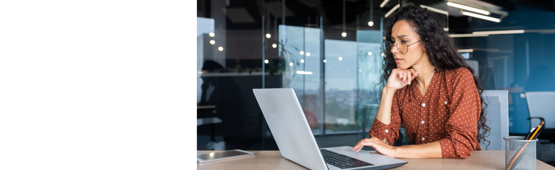 Woman staring at computer in office