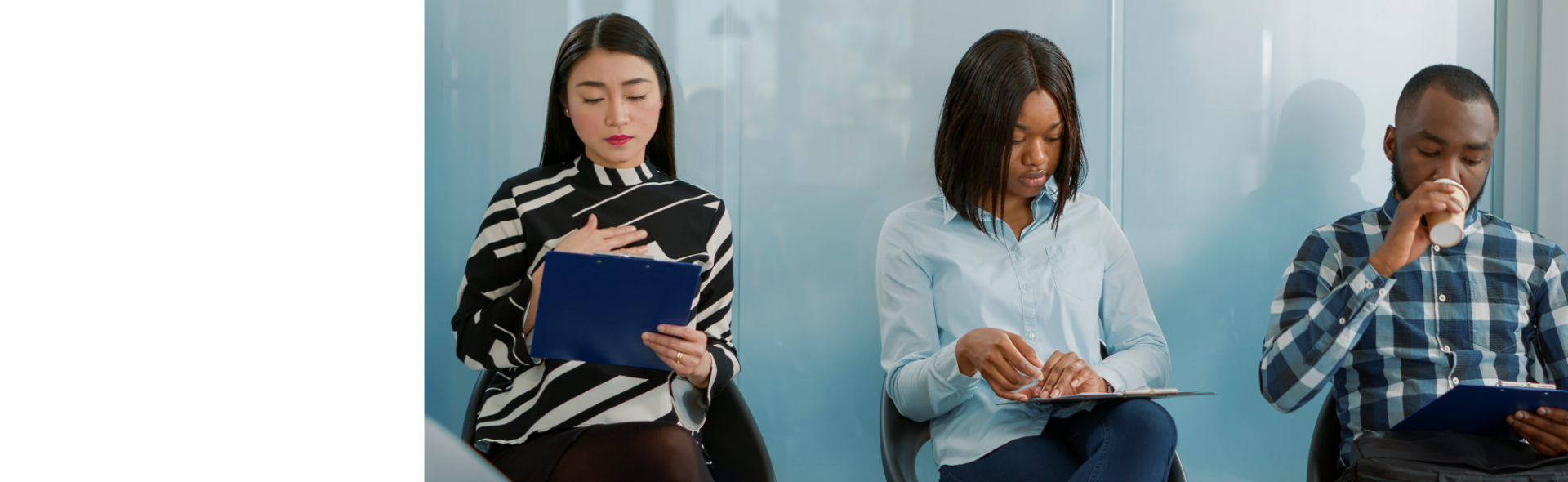 Diverse individuals sitting outside of office waiting for interview