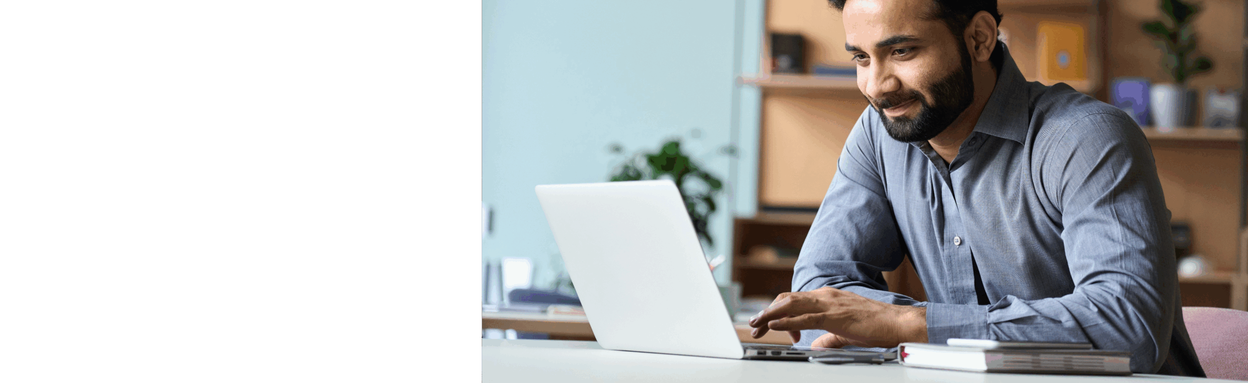 Man reading article on laptop