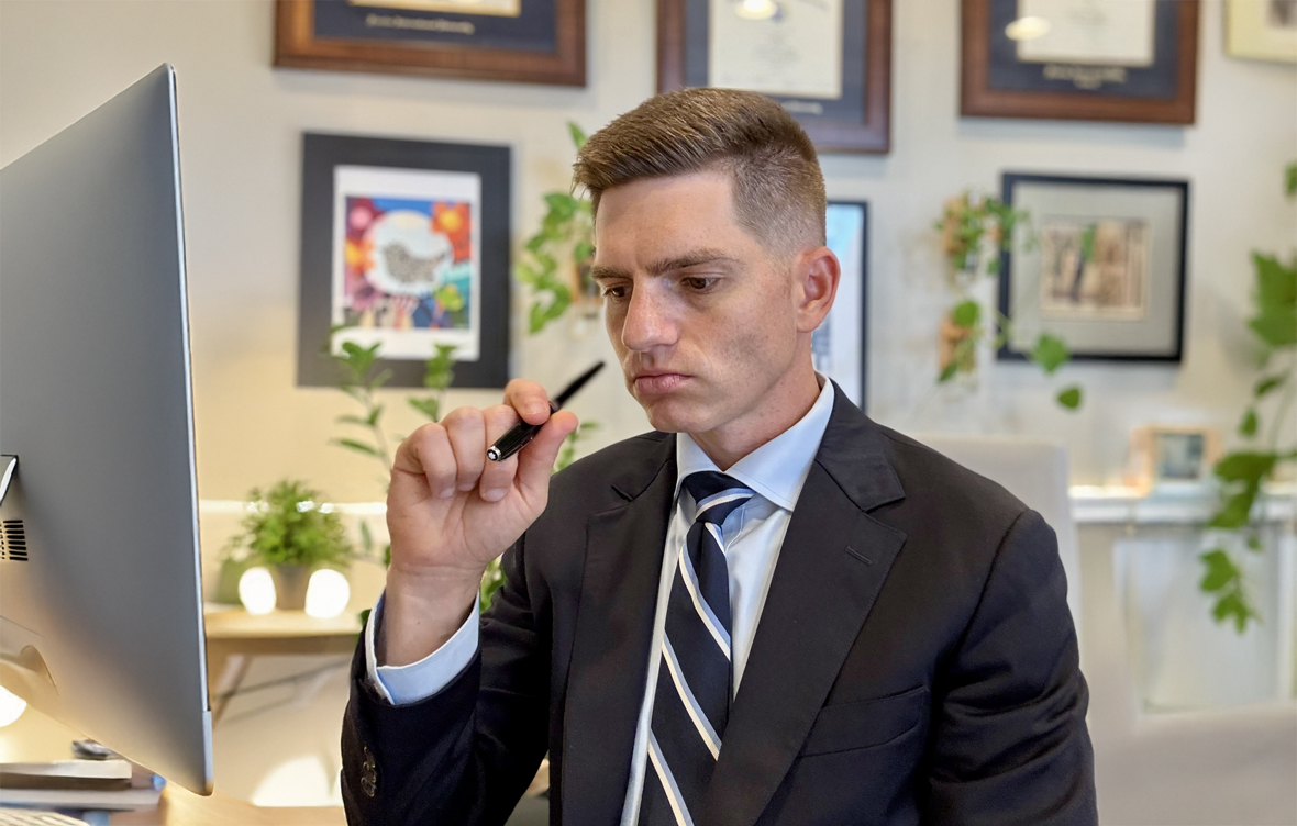 Attorney Brett Kaplan working in office